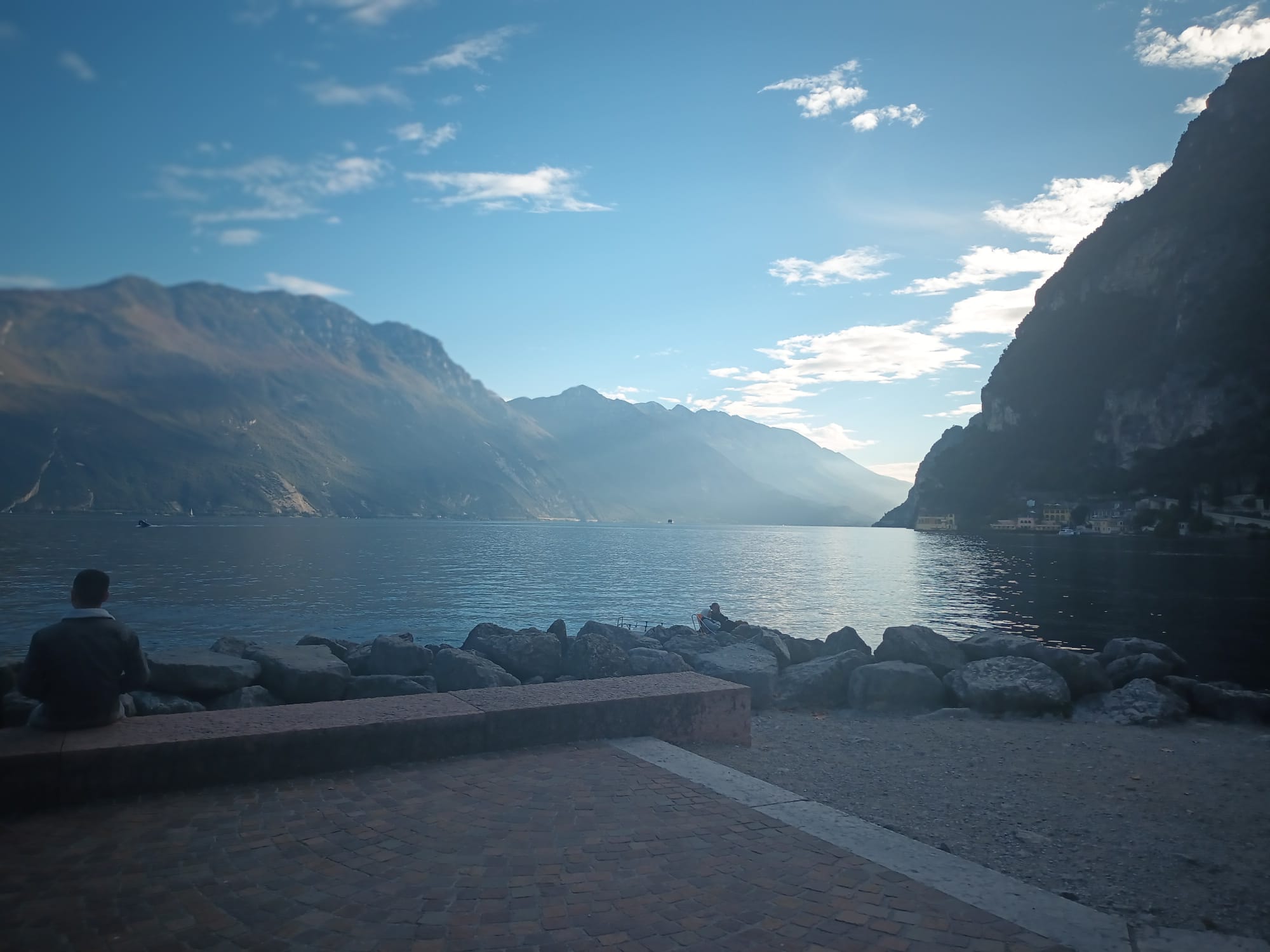 A quiet bench on the rocks, perfect for watching the light fade over the water