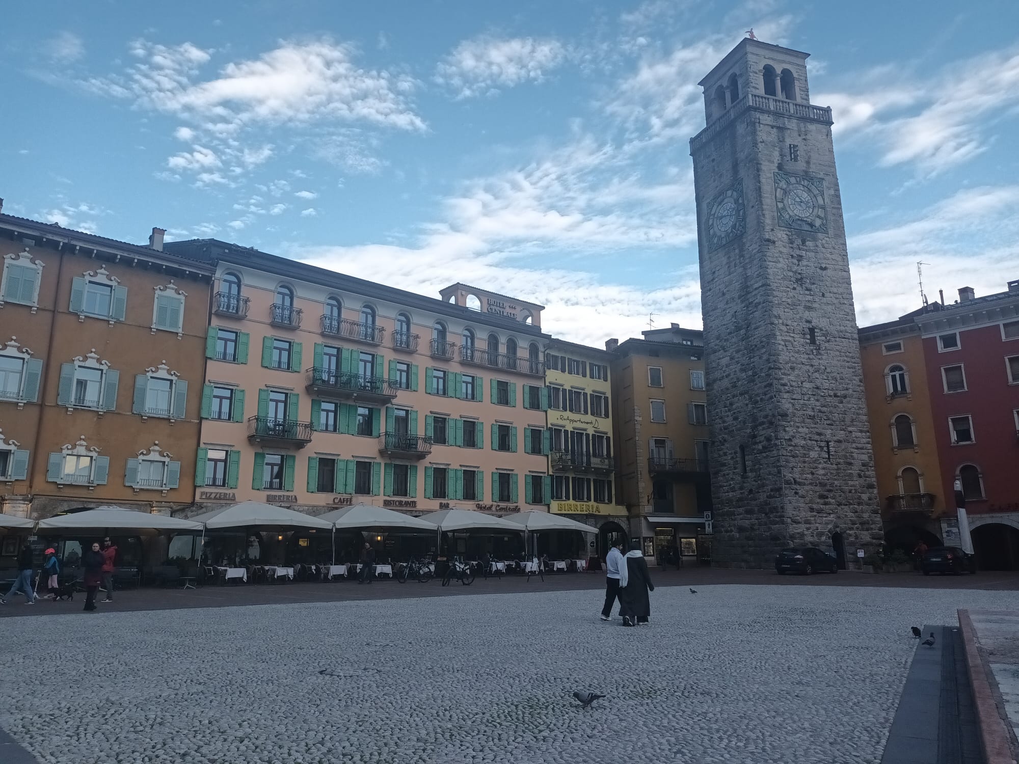 Piazza III Novembre, with the Torre Apponale rising above the pebbled square