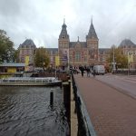 The Rijksmuseum’s historic façade beside Amsterdam’s waterways.