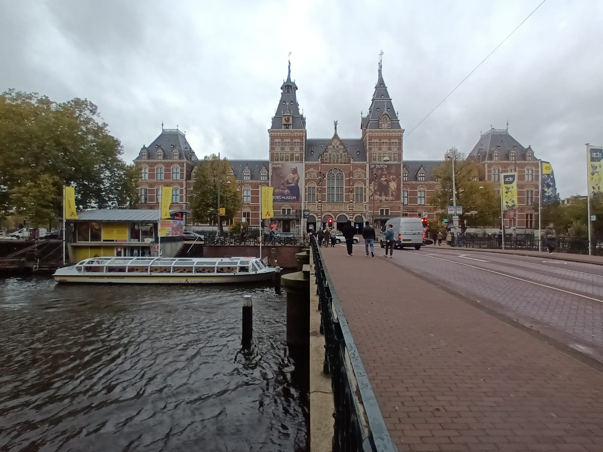 The Rijksmuseum’s historic façade beside Amsterdam’s waterways.